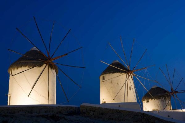 Greece, Mykonos, Hora Windmills lit at sunset